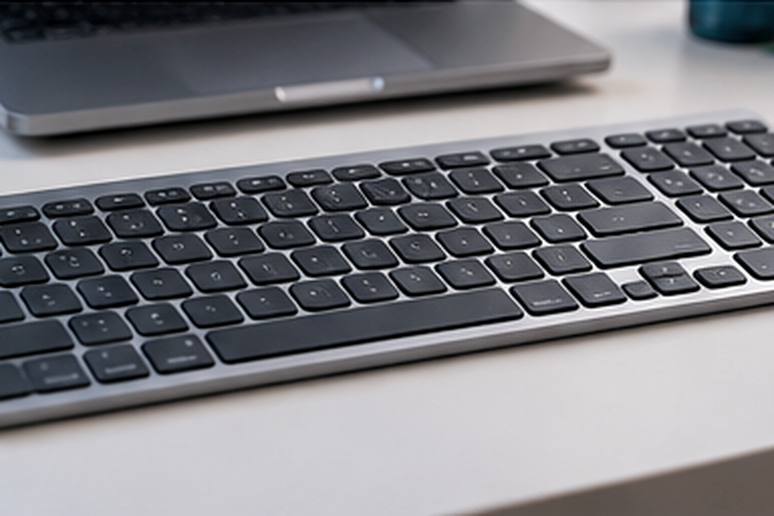 Wired keyboard connected by cable at a programmer workstation